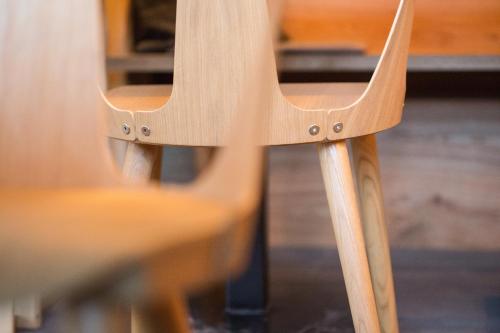 a close up of the back of a wooden chair at Arlberg Lodges in Stuben am Arlberg