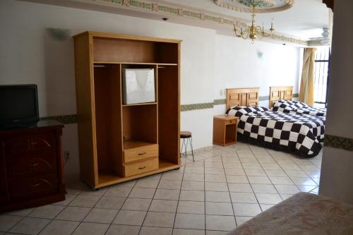Ein Bett oder Betten in einem Zimmer der Unterkunft Hotel Senorial