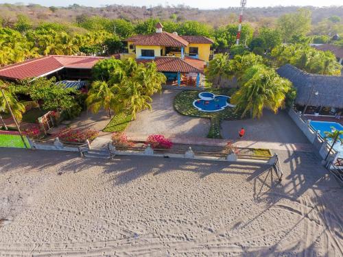 an aerial view of a house and a swimming pool at Solyar Luxury Spanish Beachfront Home in Pochomil