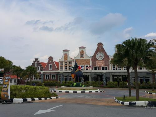 a large building with a clock on top of it at D Savoy Famosa Condo in Melaka