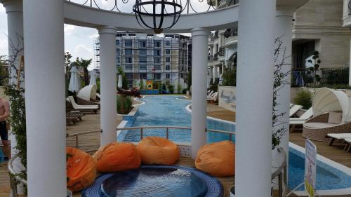 a view of a swimming pool in a resort at Harmony Suites Apartment in Sveti Vlas
