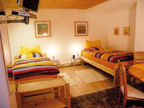 Tempat tidur dalam kamar di 2-Zimmer-Appartement-Seerose