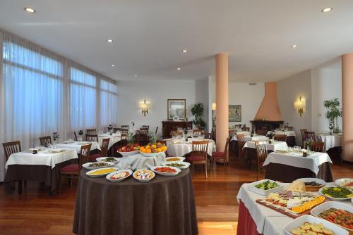En restaurant eller et spisested på Hotel Olimpia