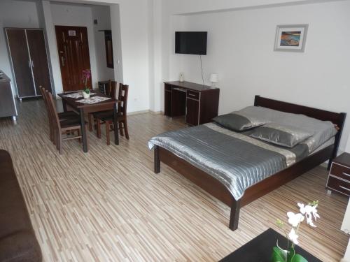 En eller flere senge i et værelse på Apartament Maja