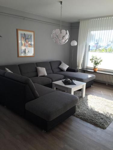 a living room with a couch and a table at Andrea-EG in Büsum