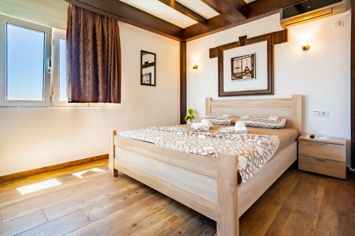 Postel nebo postele na pokoji v ubytování Apartments Tati