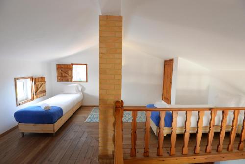Postel nebo postele na pokoji v ubytování O Monte das Flores