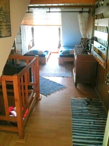 a room with a bunk bed and a living room at Ferienwohnungen-Willrich-Ferienwohnung-1 in Blankenheim