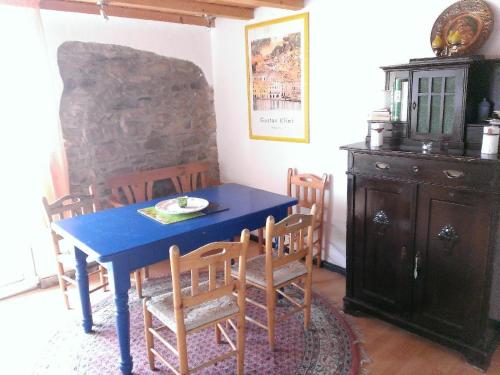 a blue table and chairs in a room at Ferienwohnungen-Willrich-Ferienwohnung-3 in Blankenheim