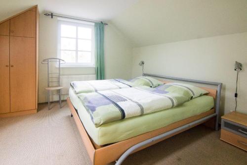 Ferienhaus Jan tesisinde bir odada yatak veya yataklar