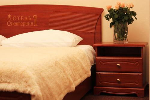 Кровать или кровати в номере Ekaterina II Hotel