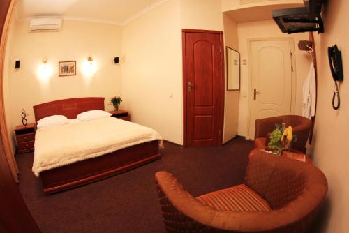 Кровать или кровати в номере Ekaterina II Hotel