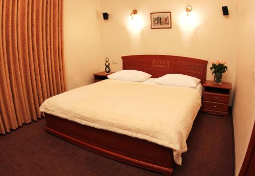 Кровать или кровати в номере Ekaterina II Hotel