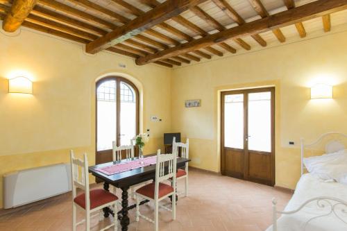 a dining room with a table and chairs at Il Borgo Di San Michele in Papigno