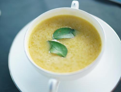 a cup of soup with a green leaf on top at Big Game - Wilpattu by Eco Team in Wilpattu