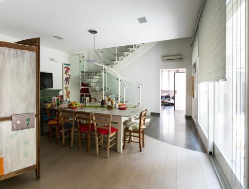 a kitchen and dining room with a table and chairs at Villa Maria in Turin