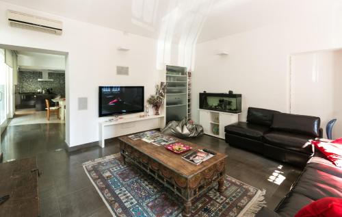 a living room with a couch and a coffee table at Villa Maria in Turin