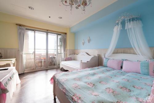 Ένα ή περισσότερα κρεβάτια σε δωμάτιο στο Migo House