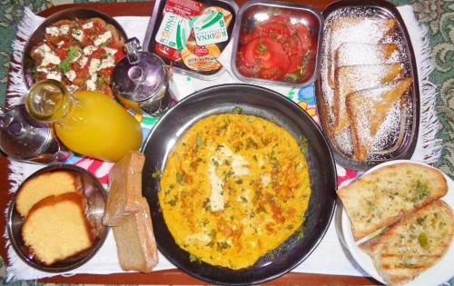 a tray of food with a plate of food at Menina Farm Kalamata Countryside in Perivolákia