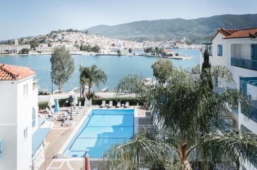 a view of the water from the balcony of a hotel at Nikis Village in Poros