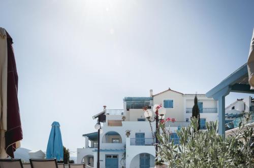 a view of a white building with a building at Nikis Village in Poros