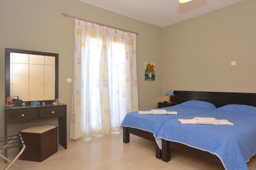 Postel nebo postele na pokoji v ubytování Alexandra Apartment