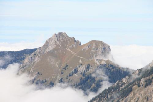 a mountain obscured by clouds in the mountains at Haus Kristall in Tannheim