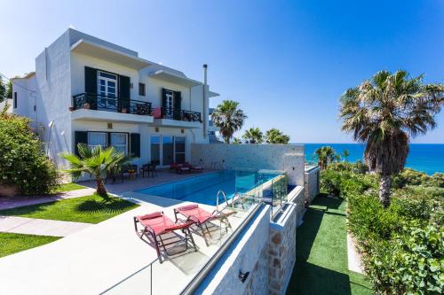 a villa with a view of the ocean at Sea View Villas in Episkopí- Rethimno