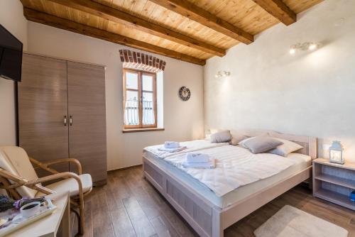 Postel nebo postele na pokoji v ubytování Villa Dumina