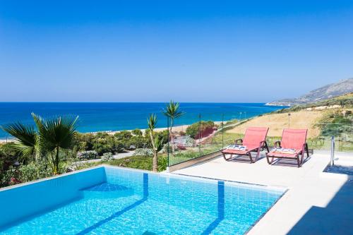 a villa with a pool and a view of the ocean at Sea View Villas in Episkopí- Rethimno
