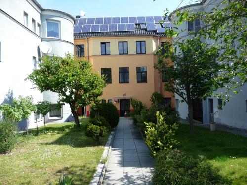 a house with solar panels on the roof at Ferienwohnungen Rehn in Dresden