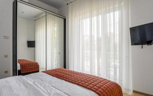 Postel nebo postele na pokoji v ubytování Hotel Sorrento