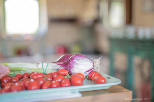 a plate of vegetables sitting on a table at Villa "Piemonte" in Tigliole