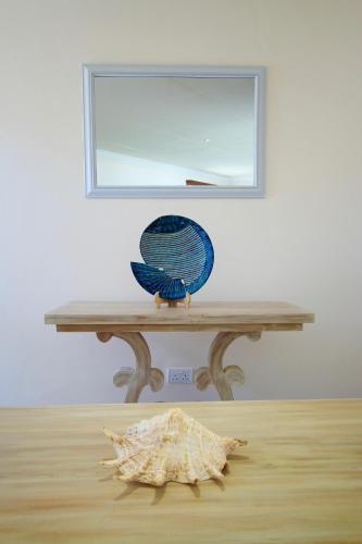 a blue bird sitting on top of a table at The Zubeida Boutique Resort in Diani Beach
