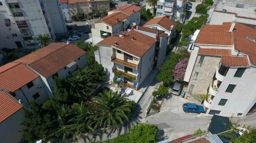 an overhead view of a city with houses and trees at Apartman Biljana in Makarska
