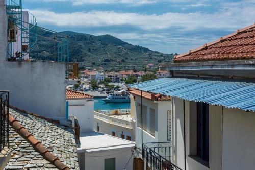 a view of a harbor from the roofs of buildings at Evagelia's deluxe villa-Roof Top Jacuzzi in Skopelos Town