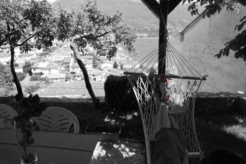 a hammock in a yard with a view of a city at Snegar Apartments in Ohrid