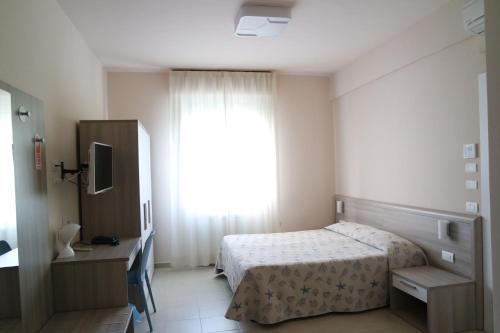 Ένα ή περισσότερα κρεβάτια σε δωμάτιο στο Hotel Villa San Giuseppe