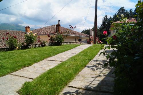 a stone path in front of a house at Snegar Apartments in Ohrid