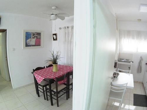 a dining room with a table and chairs at Dead Sea Yehuda Apartments in Arad