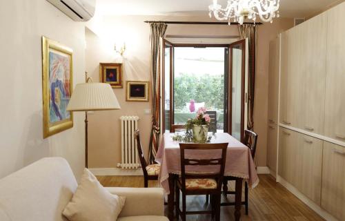 a dining room with a table and a window at Sweet Central appartment in San Benedetto del Tronto