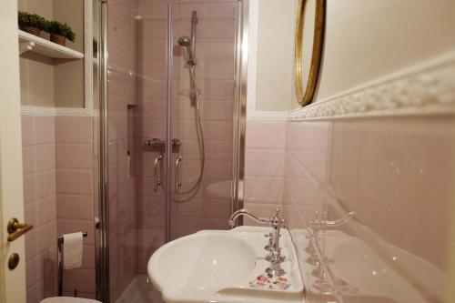 a bathroom with a shower and a sink and a toilet at Sweet Central appartment in San Benedetto del Tronto
