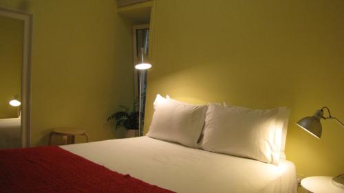Un pat sau paturi într-o cameră la Foz Gardens