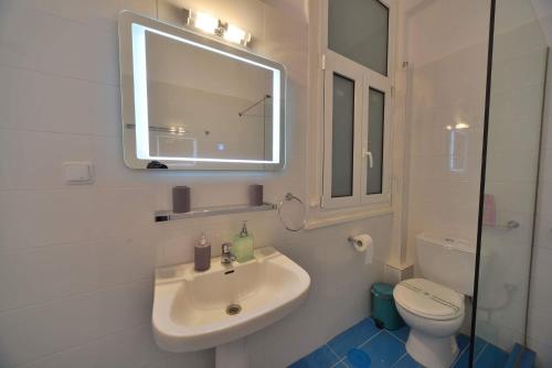 A bathroom at Oasis veranda under columns.Kolonaki embassy area.