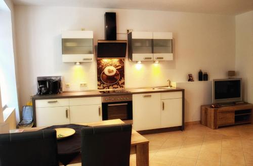 Η κουζίνα ή μικρή κουζίνα στο Apartments Altstadthaus Görlitz