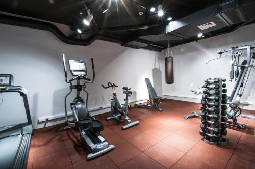 a gym with several exercise bikes in a room at Best Western Premier Natalija Residence in Belgrade