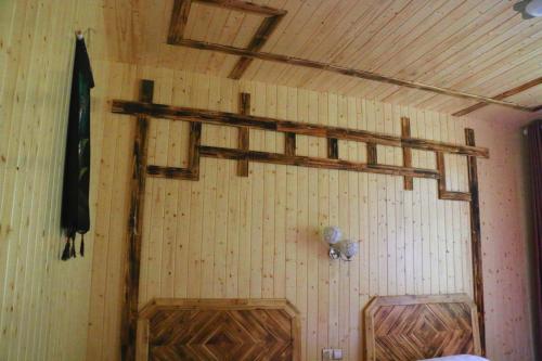 a room with two wooden shelves on the wall at Zhangjiajie one step to heaven inn (Yangjiajie ticket office) in Zhangjiajie