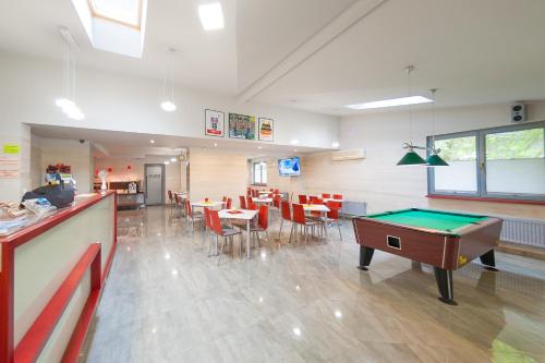 a room with a pool table and a bar at Pensjonat Źródełko in Ustroń