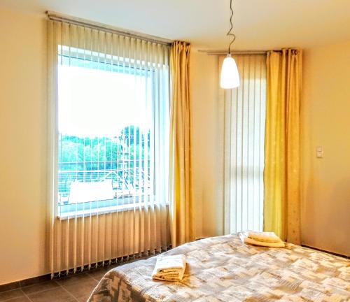 Кровать или кровати в номере Luxury Breeze Apartment