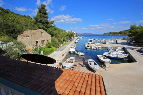 a view of a marina with boats in the water at Apartment and rooms Roko in Zaglav